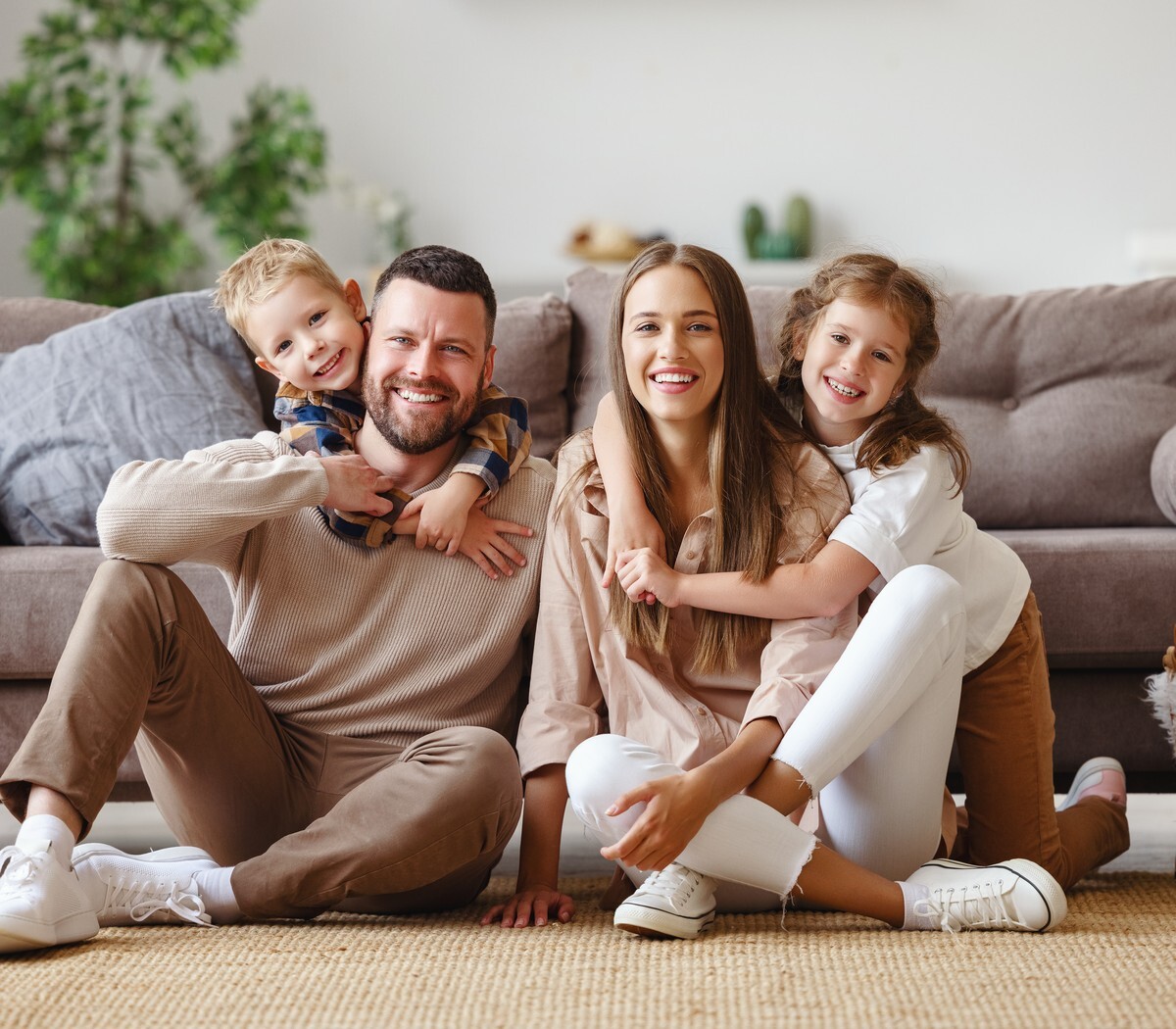 Family smiling together at home