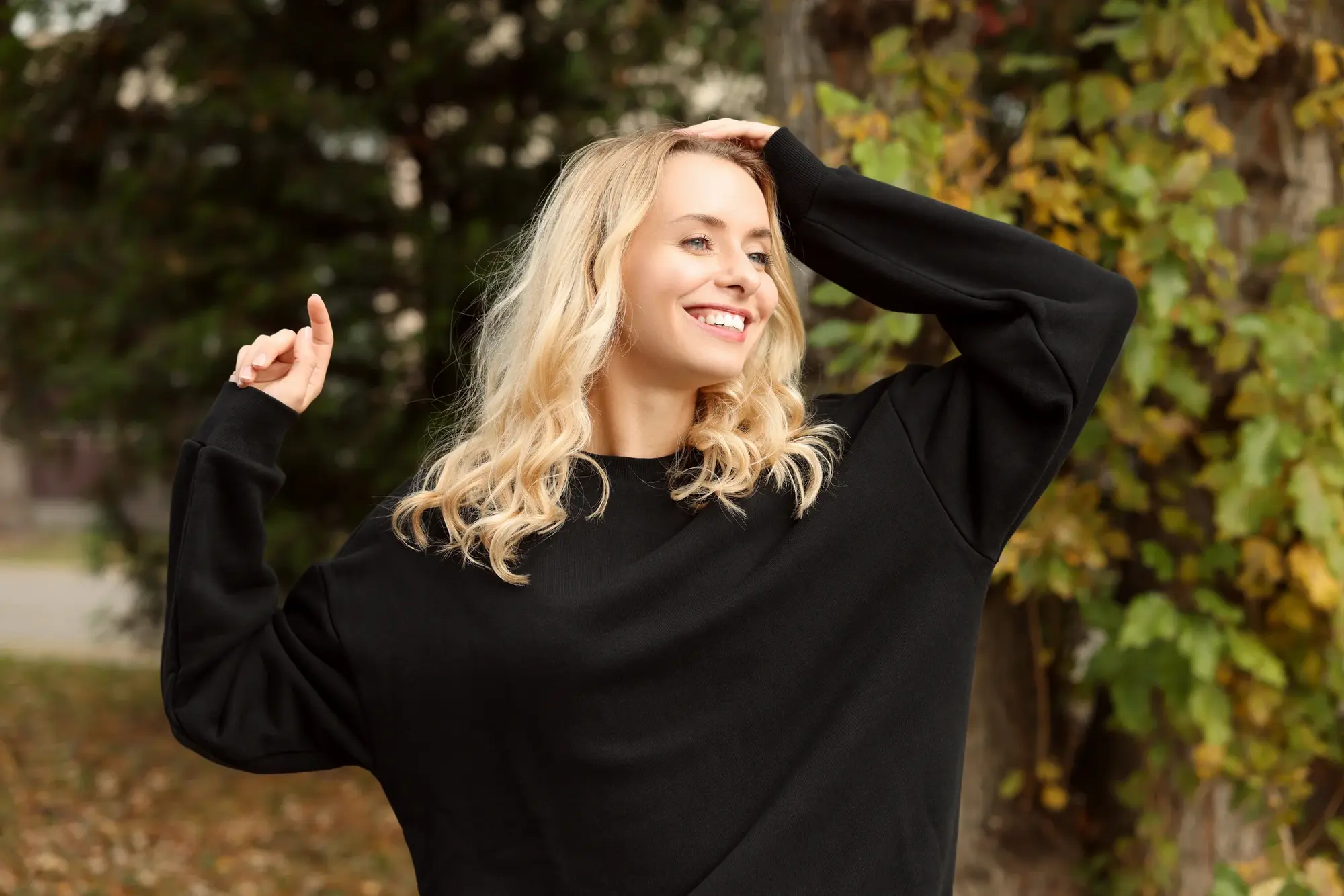 Blonde woman smiling outdoors